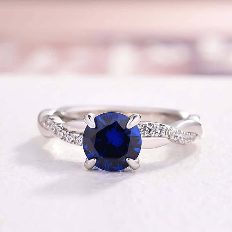 Twist 1.25 Carat Blue Sapphire Round Cut Promise Ring from Black